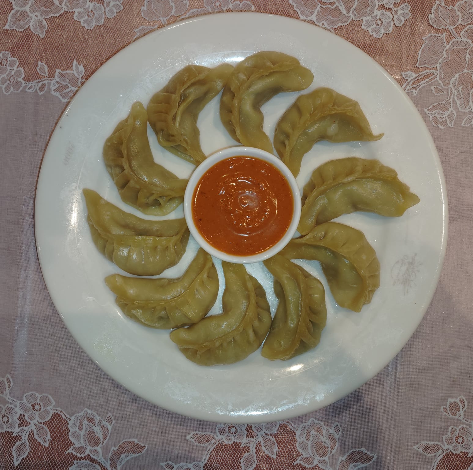 Steam momo served with dipping sauce